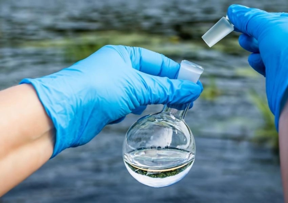 a researcher is taking water samples